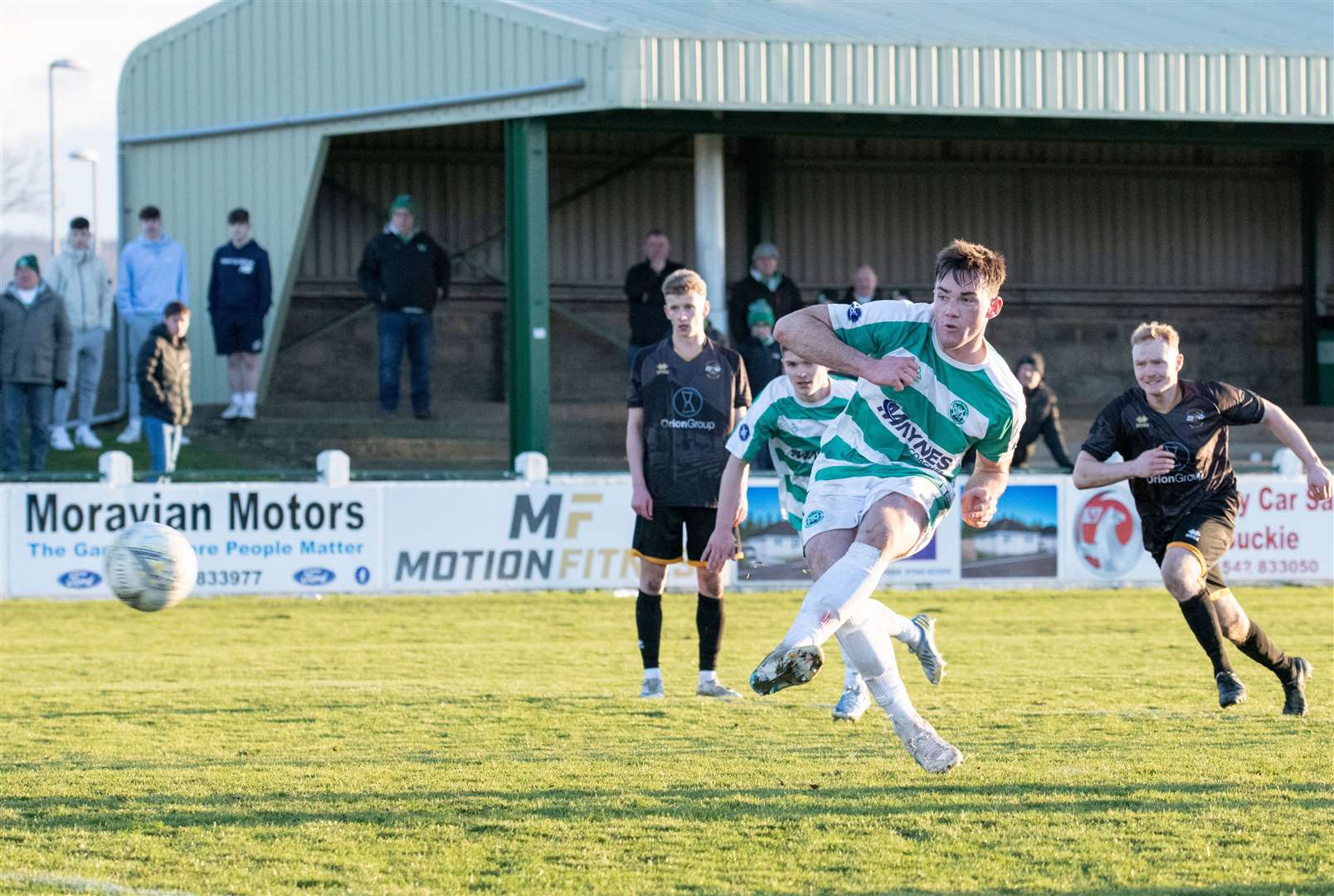 Buckie's Jack Murray scores the equalising penalty. ..Buckie Thistle FC (2) vs Clachnacuddin FC (3) - Highland Football League 23/24 - Victoria Park, Buckie 24/02/2024...Picture: Daniel Forsyth..