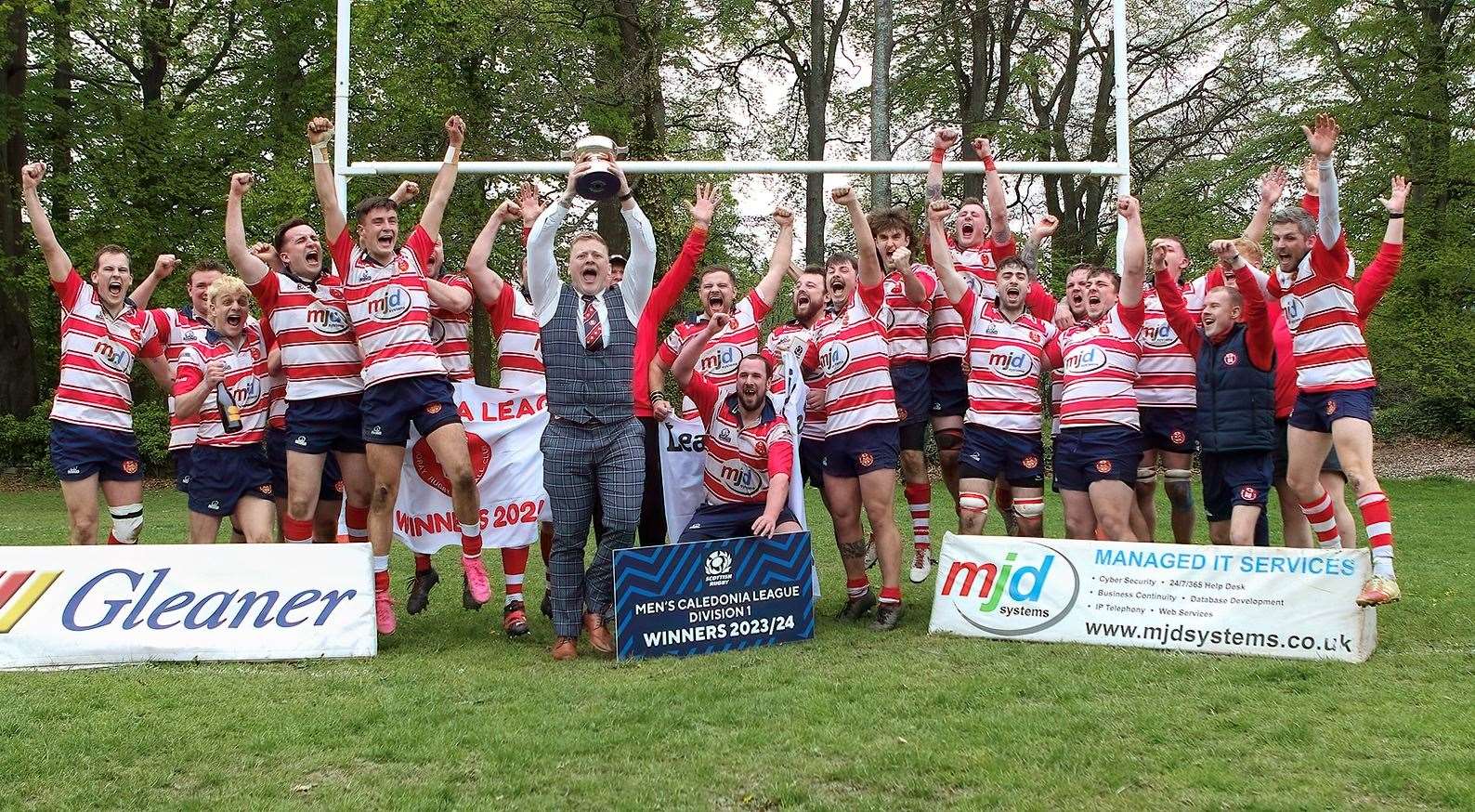 Captain Lewis Scott lifts the Caledonia Division 1 trophy with his team-mates. Picture: John MacGregor