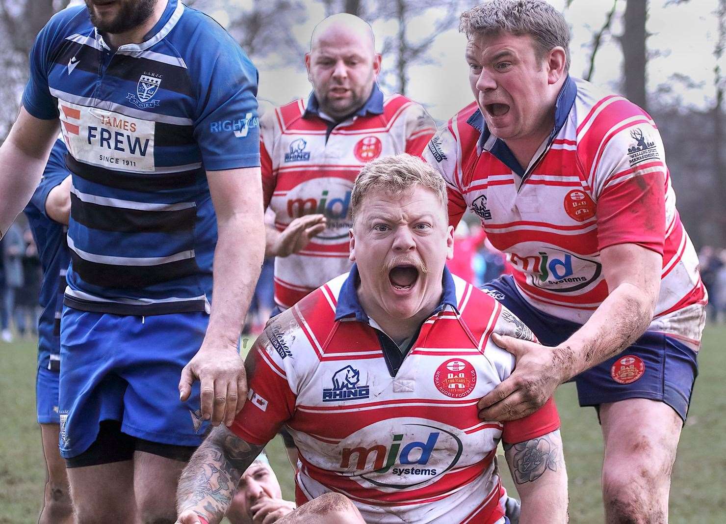 Lewis Scott celebrates his last-gasp try with his Moray team-mates. Photos: John MacGregor
