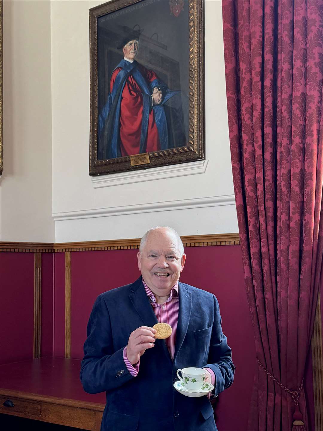 Sir Alexander Grant looks down approvingly over Alan James, chairman and director of Forres Events Limited.