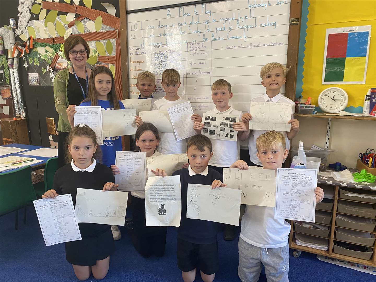 Mrs Cumming and her class presenting their designs.