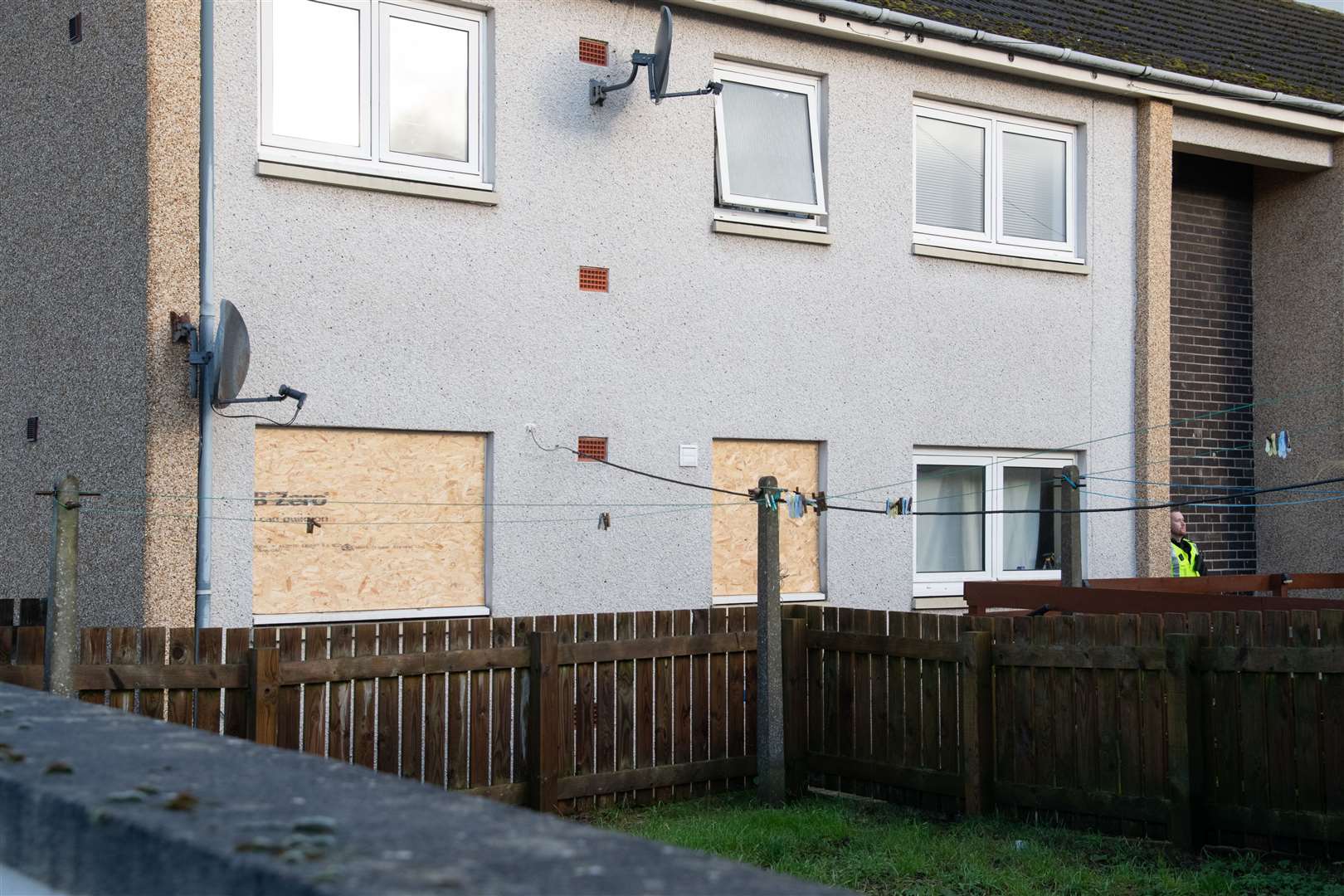 The property has been boarded up and remains guarded by police officers. Picture: HNMedia