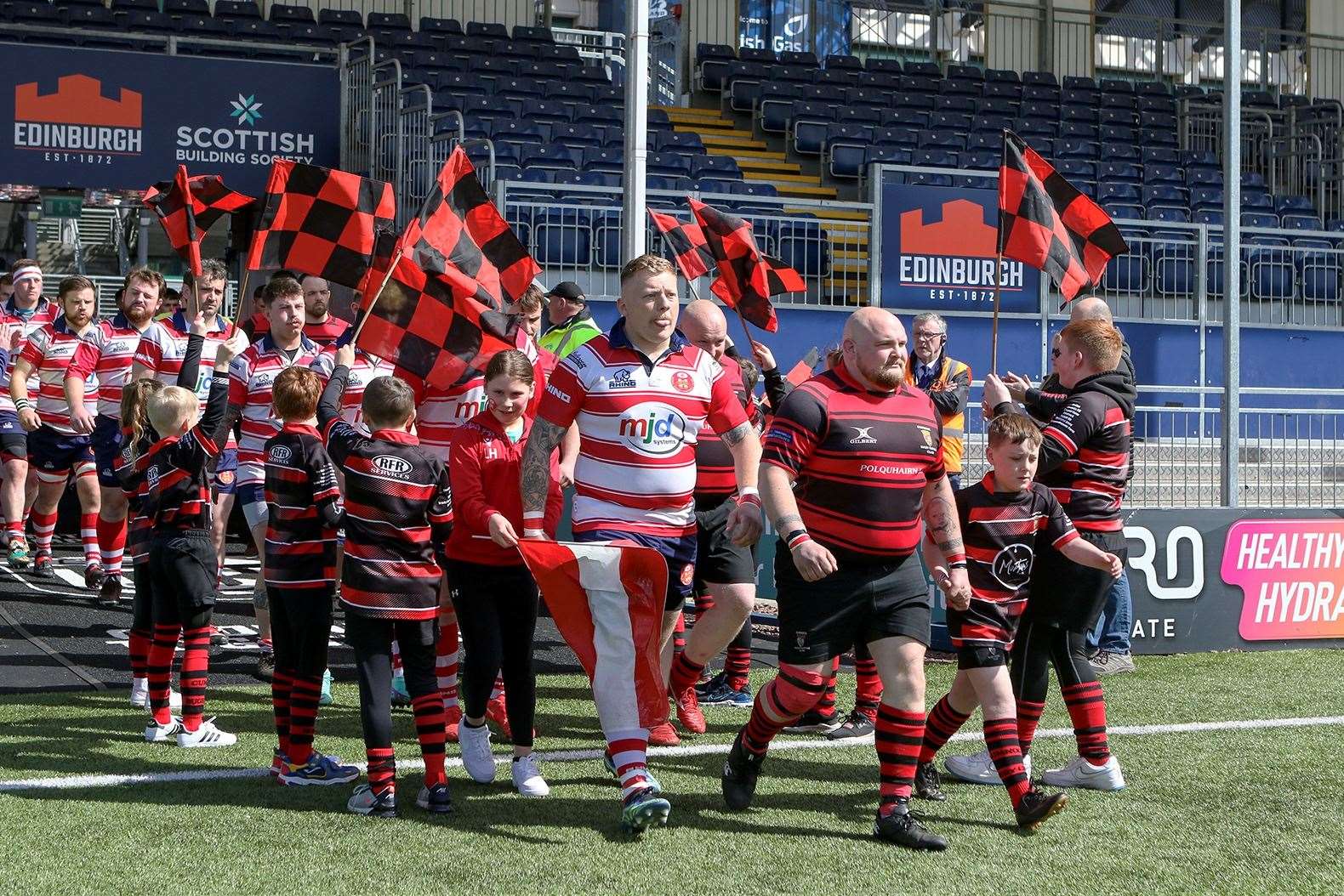 Lewis Scott leads Moray on to the pitch. Picture: John MacGregor