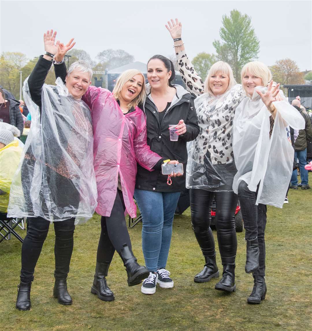 Ashley Cargill (second left) enjoying the day with friends and family despite the rain.